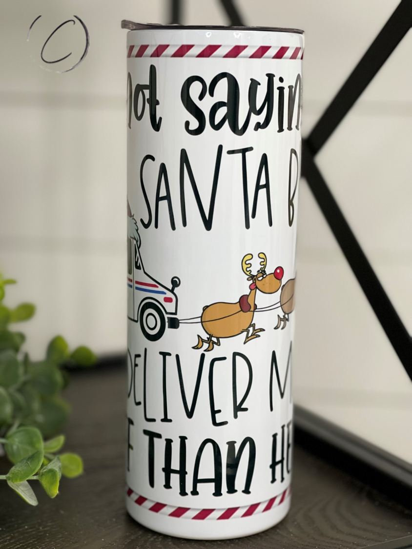 Delivered More Stuff Than Santa 20oz Skinny Tumbler with festive design and reusable straw.