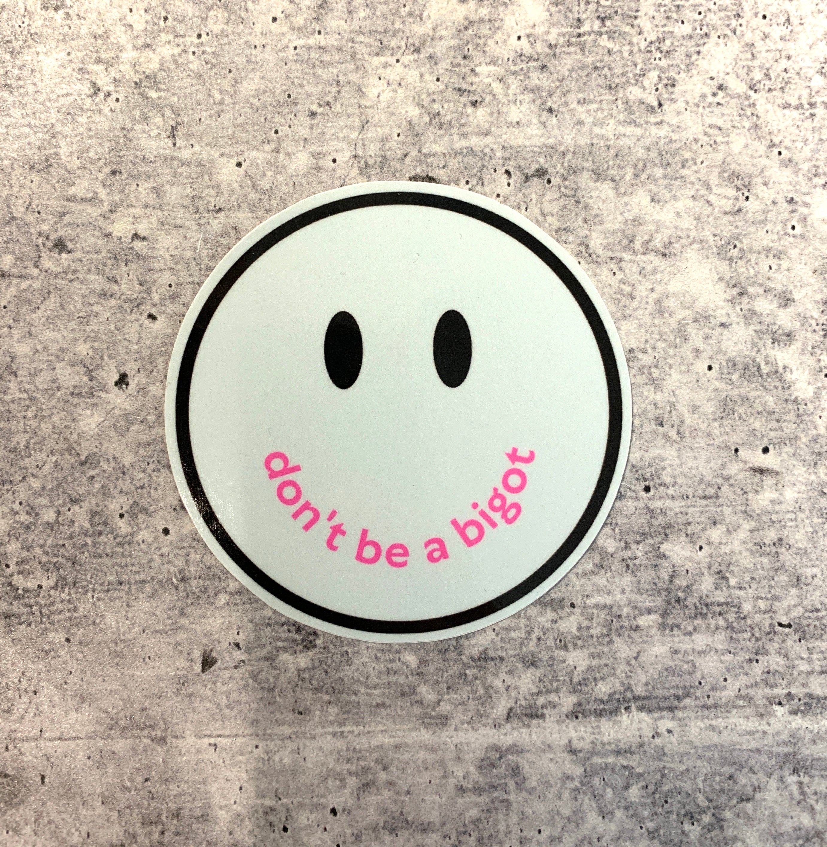 Don't Be a Bigot Smile Face Sticker with vibrant colors and a positive message promoting inclusivity.