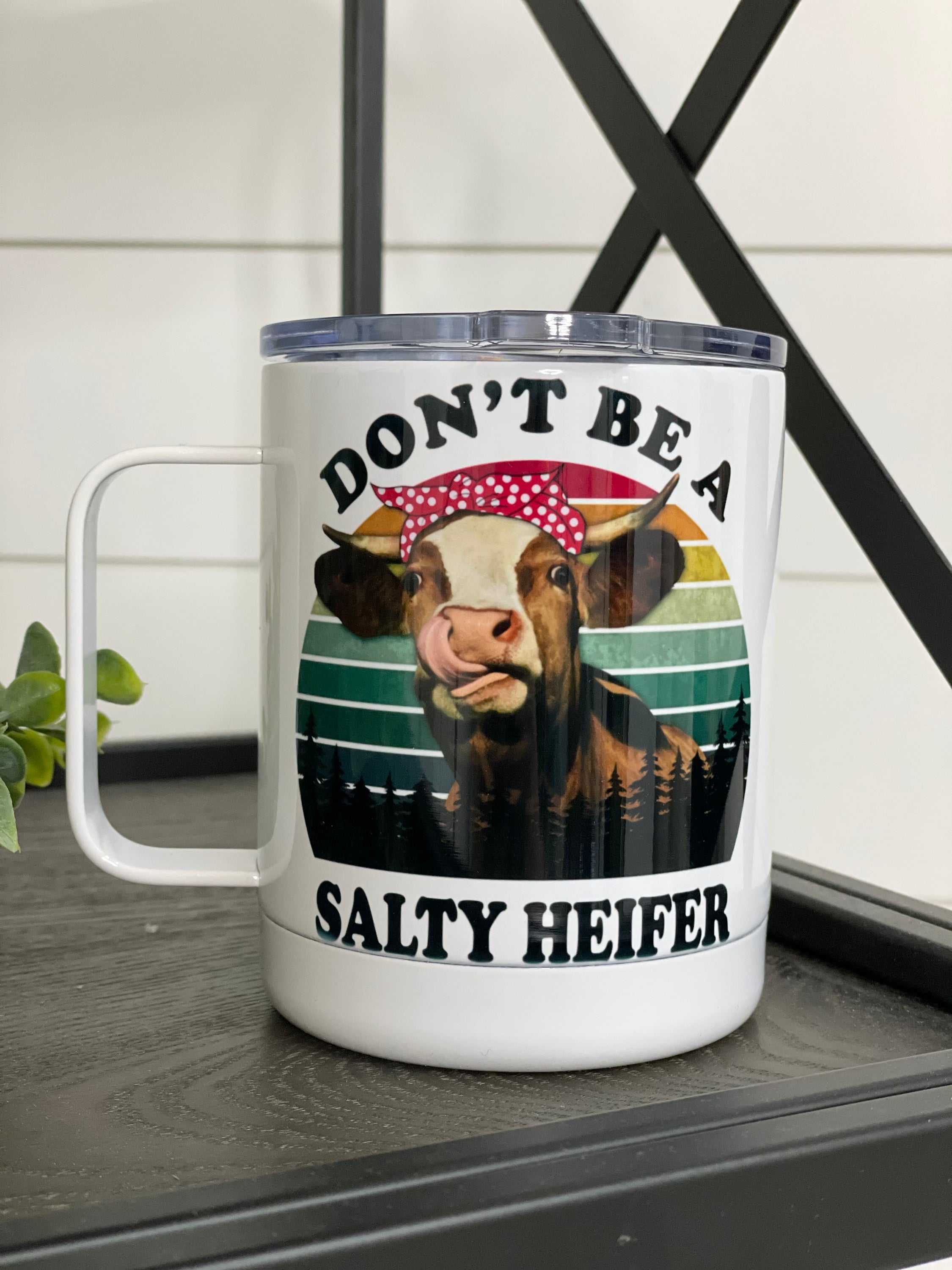 Don't Be A Salty Heifer 11oz Travel Mug featuring a humorous design on both sides, perfect for coffee and tea lovers.