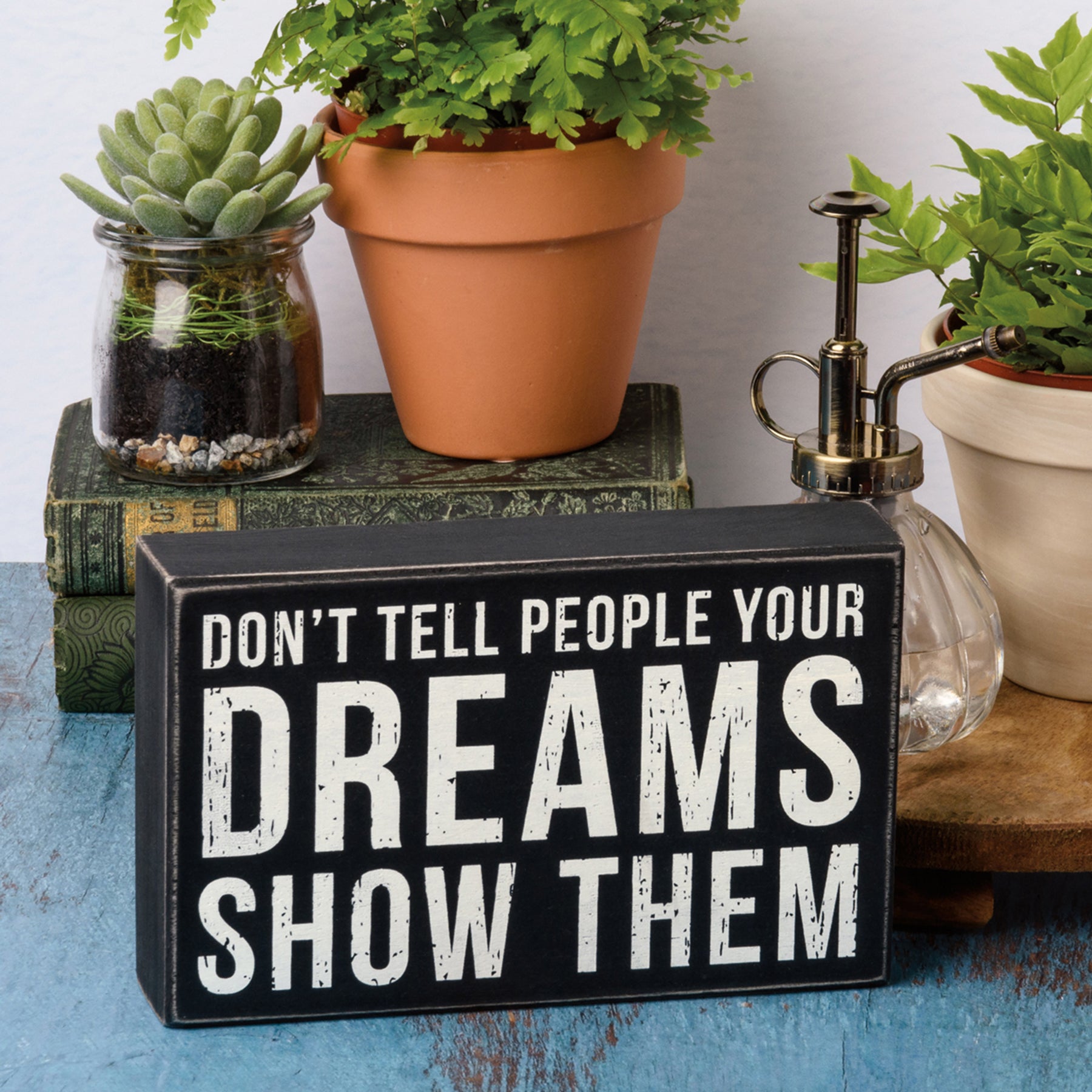 Rustic wooden box sign with black and white text reading 'Don't Tell People Your Dreams Show Them', perfect for home decor.