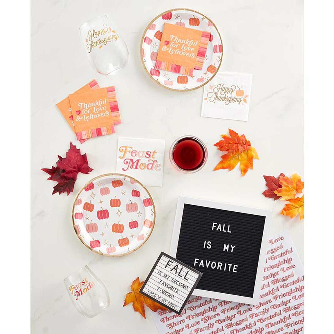 A set of black and white beverage napkins with the phrase 'Fall Is My Second Favorite F-Word, Food Is My First' designed for autumn celebrations.