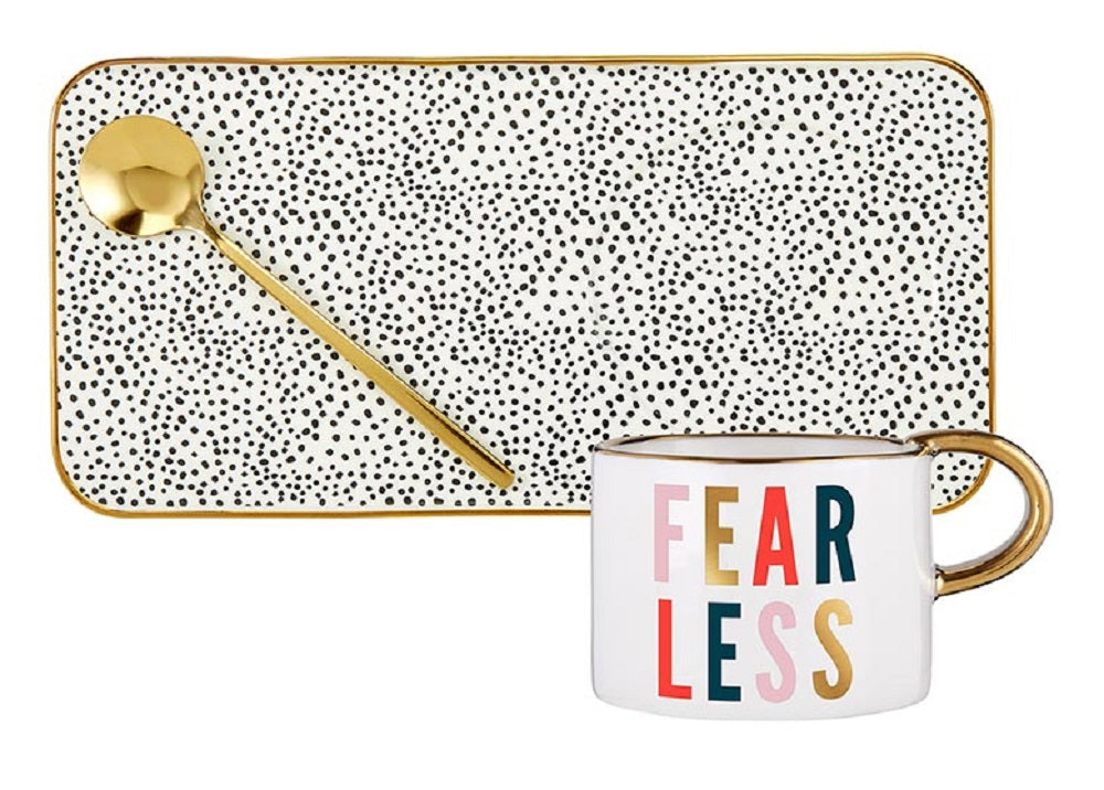 Fearless Mug, Tray, and Spoon Set featuring a black ceramic mug with 'BADASS' in gold lettering, a floral patterned tray, and a gold spoon.