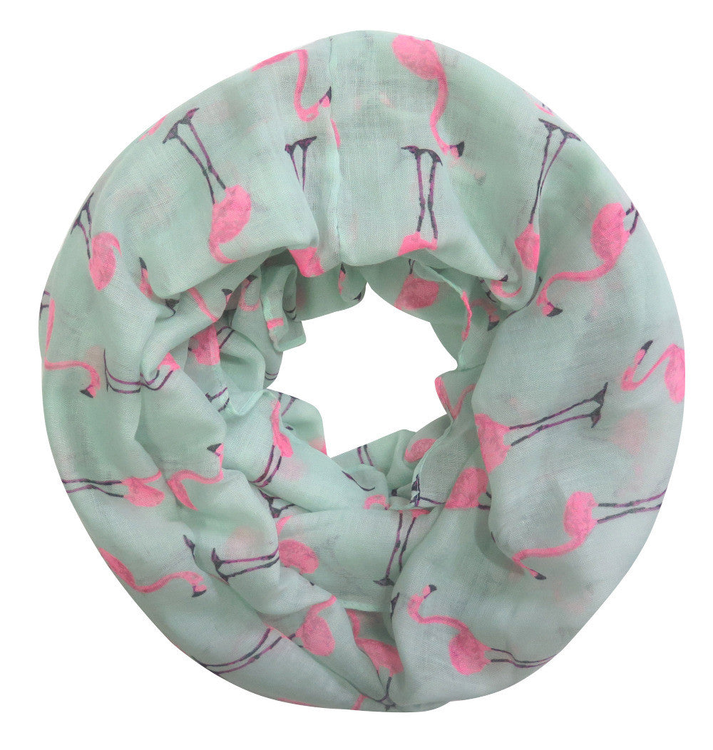 A vibrant pink and mint flamingo infinity scarf, showcasing a playful design perfect for summer wear.