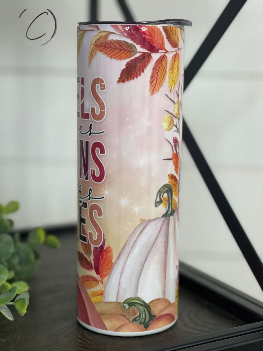 A stylish 20oz skinny tumbler featuring a full wrap design of flannels, pumpkins, and bonfires, perfect for autumn beverages.