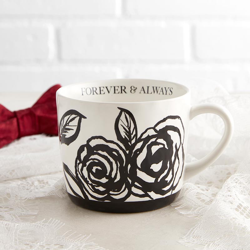 White stoneware mug with black floral artwork and the phrase 'Forever & Always' printed on it, perfect for gifting.