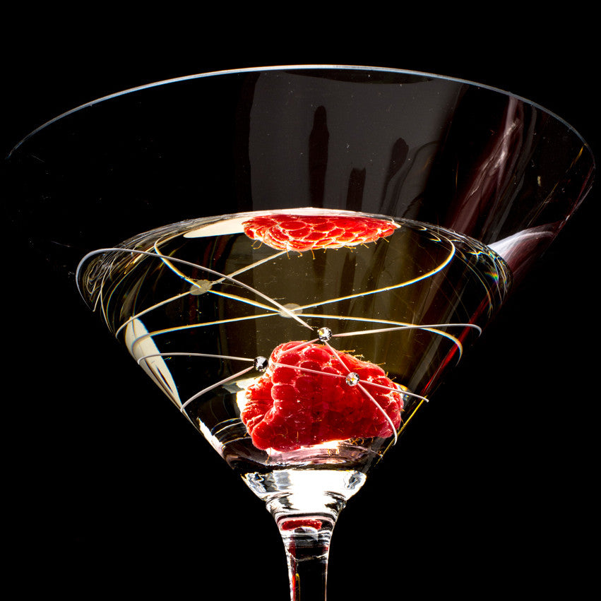 Set of two Galaxy Spirals Martini Glasses with intricate spiral design and crystal stones, elegantly displayed in a gift box.