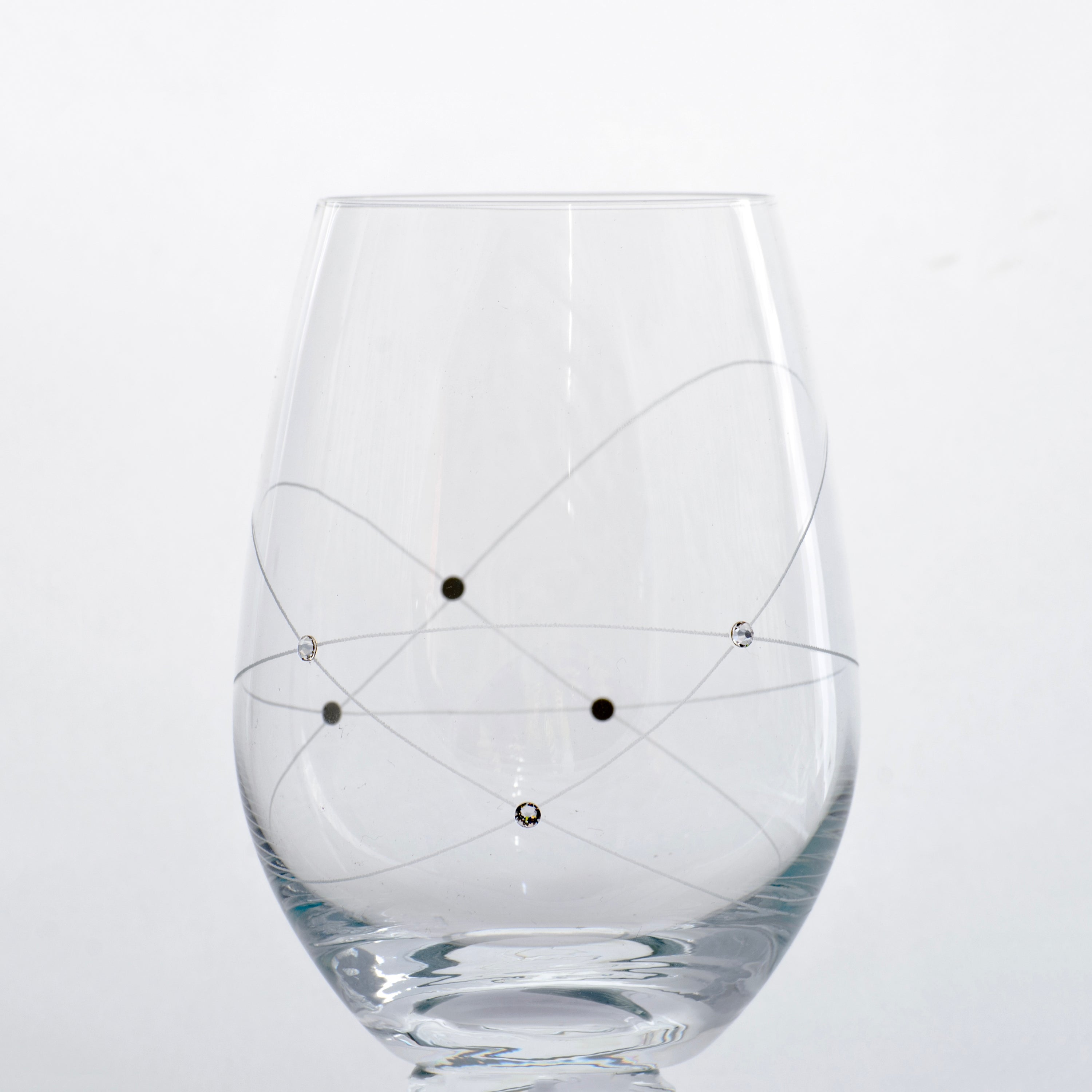 A set of two elegant Galaxy Spirals stemless wine glasses adorned with Swarovski crystals, beautifully presented in a gift box.