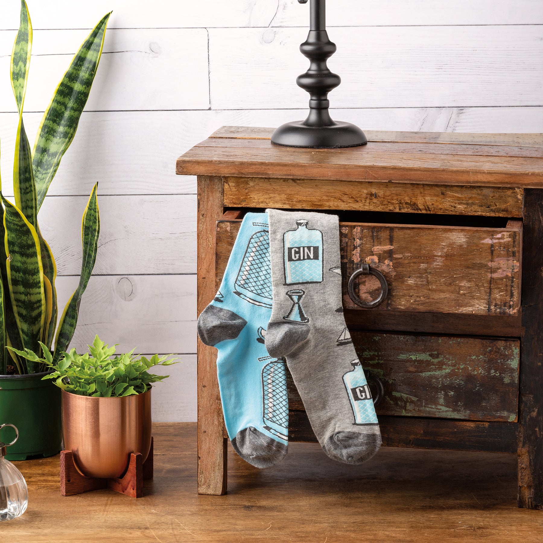 Gray and blue mismatched novelty socks featuring woven gin and tonic designs, perfect for fun-loving gin enthusiasts.