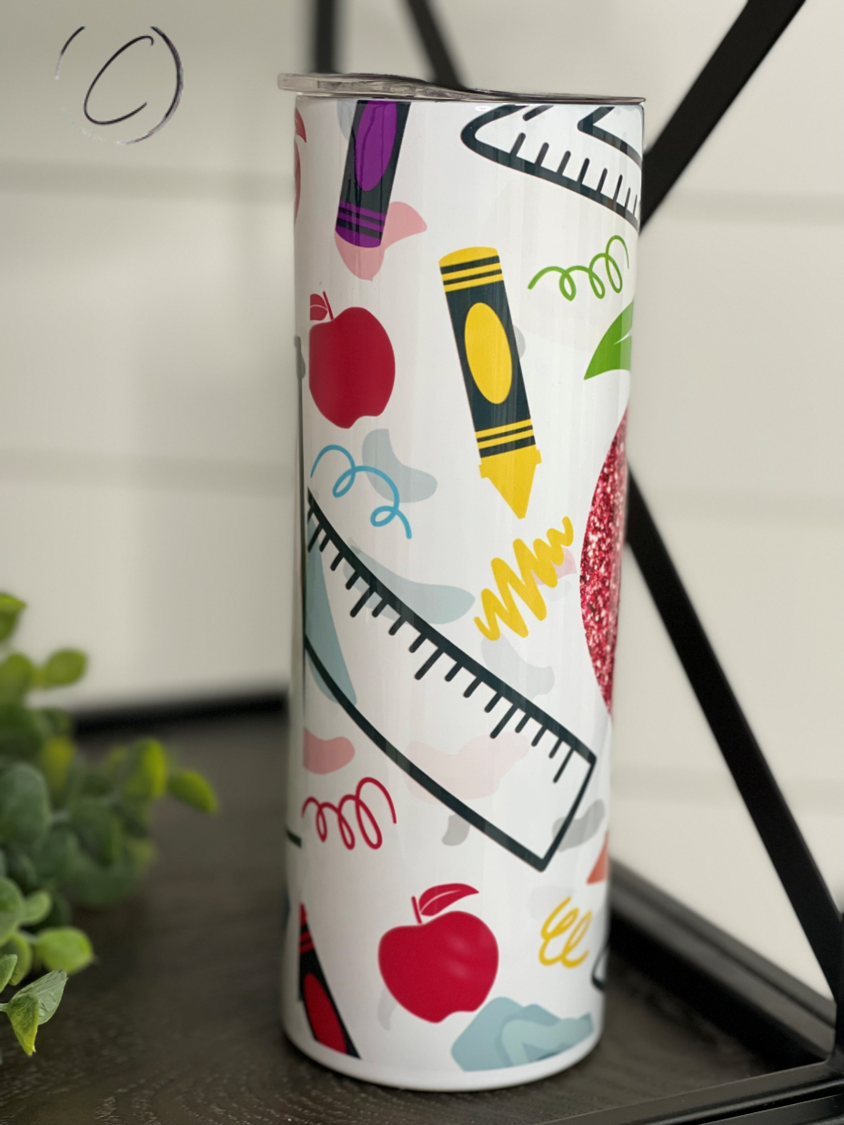 Glitter Apple 20oz Skinny Tumbler with a vibrant glitter apple design, featuring a reusable straw and a sleek insulated body.