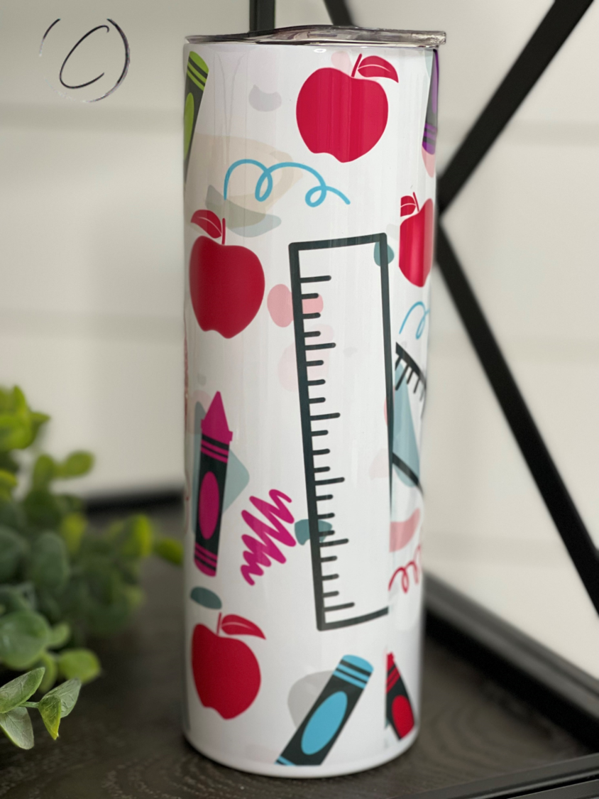 Glitter Apple 20oz Skinny Tumbler with a vibrant glitter apple design, featuring a reusable straw and a sleek insulated body.