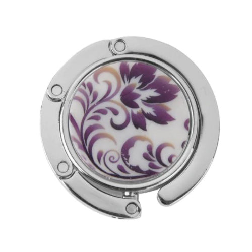 Stylish silver graphic purse hanger with a decorative medallion, designed to keep handbags off the floor.
