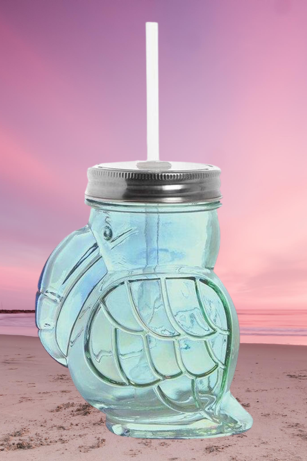 Green toucan shaped sipper made of iridescent glass with a lid and straw, perfect for cocktails or wine.