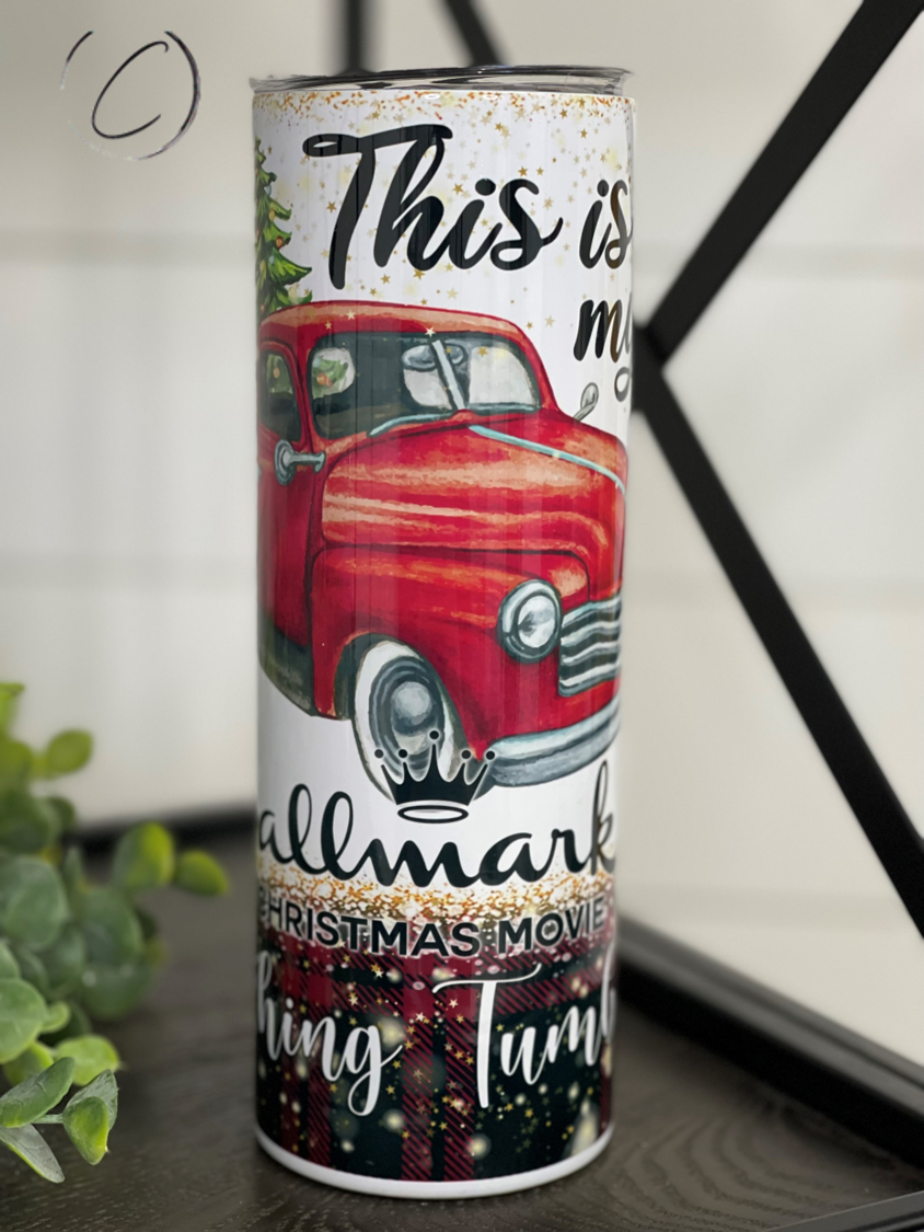 Hallmark Christmas Movie Watching 20oz skinny tumbler with festive design and reusable straw.