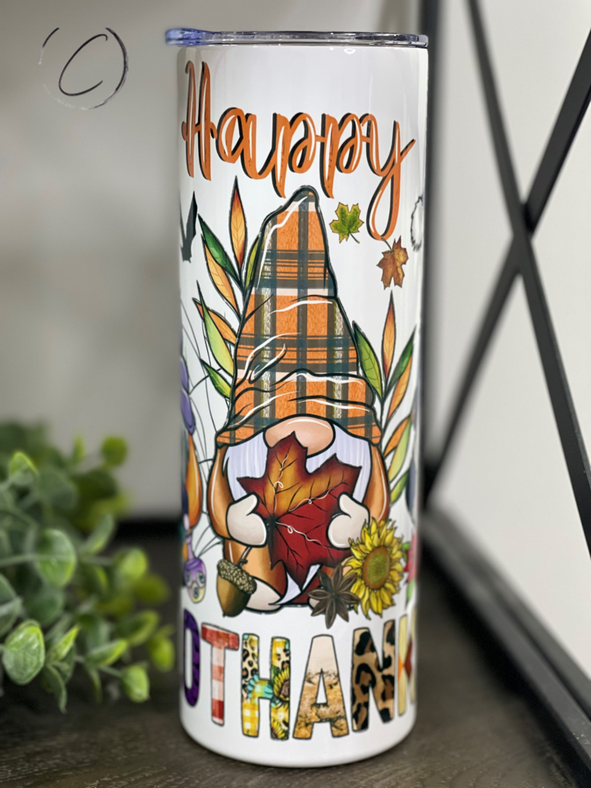 Happy Hallothanksmas 20oz Skinny Tumbler featuring a festive design for Halloween, Thanksgiving, and Christmas celebrations.