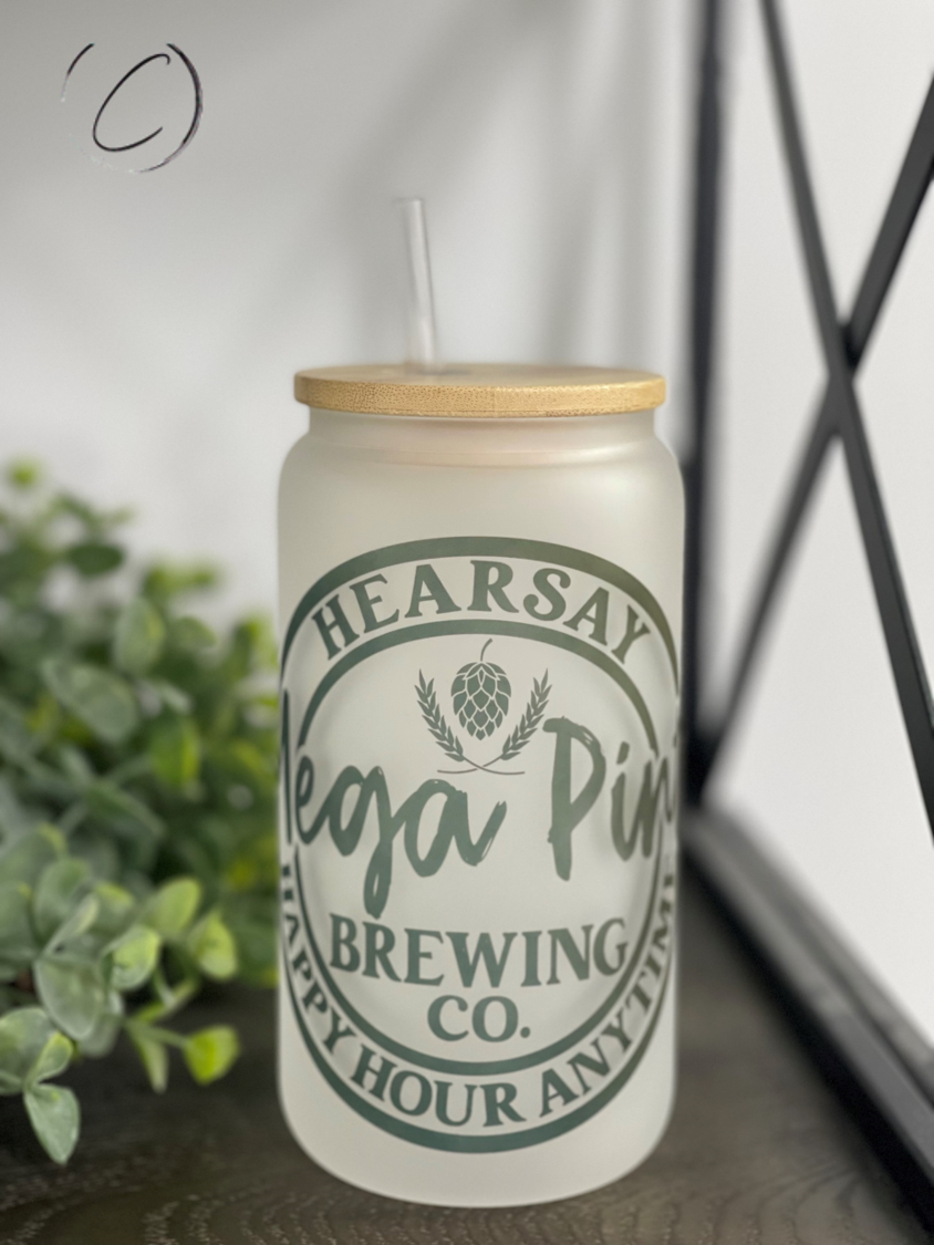 Hearsay Brewing Co. 16oz Libbey Glass with a unique full wrap design and included straw, showcasing its durable and stylish appearance.