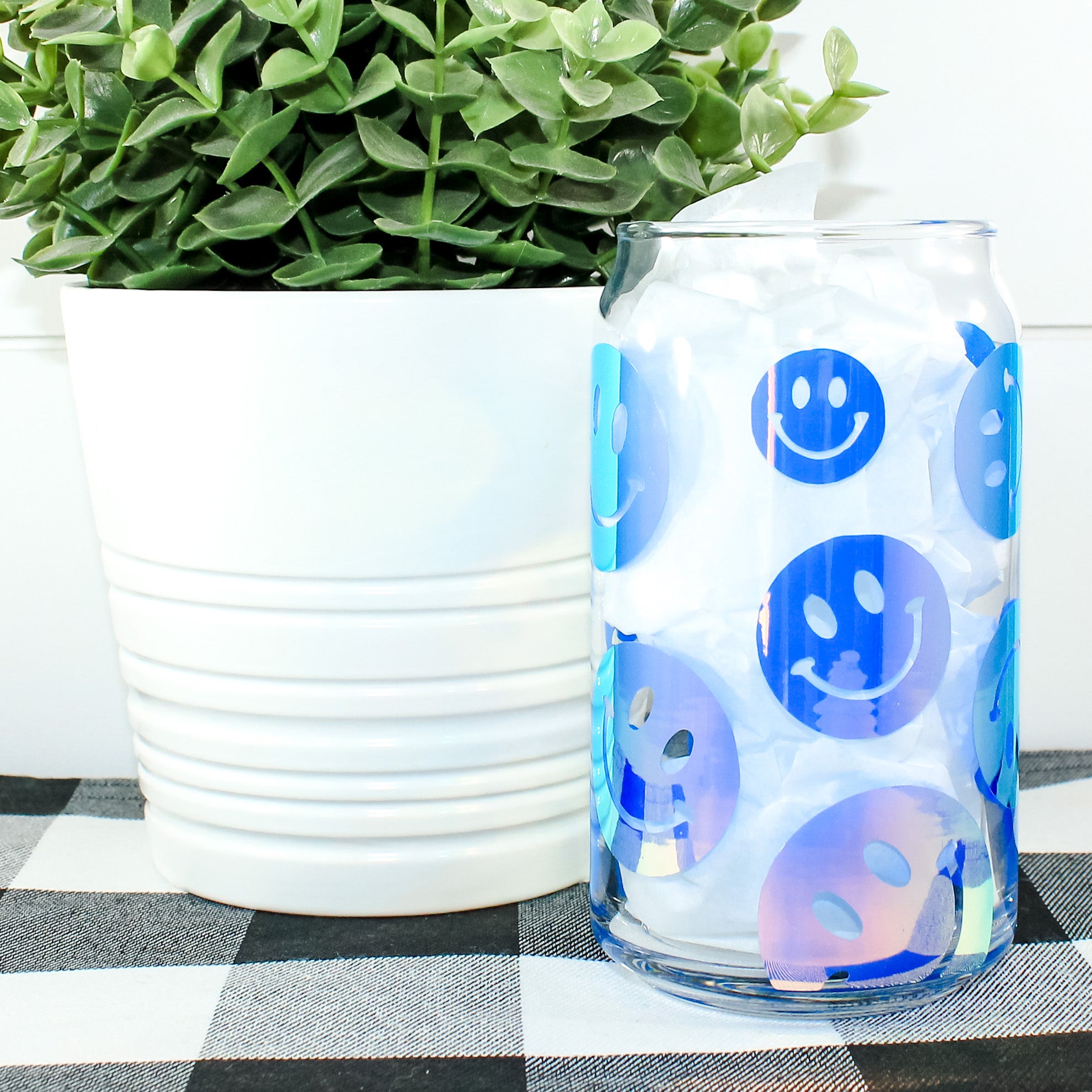 A colorful Holographic Smile Wrap Can Glass showcasing a vibrant design, perfect for drinks.