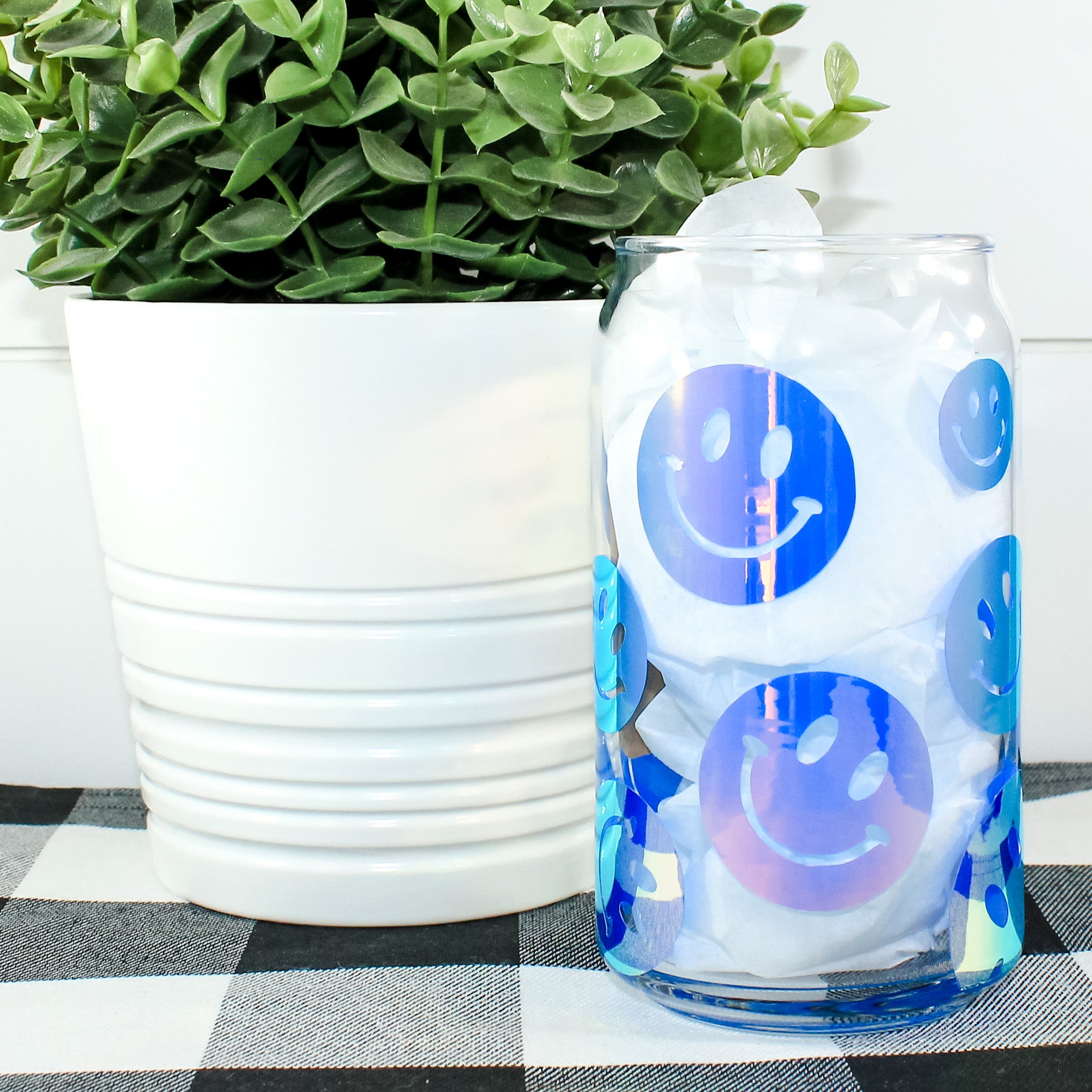 A colorful Holographic Smile Wrap Can Glass showcasing a vibrant design, perfect for drinks.