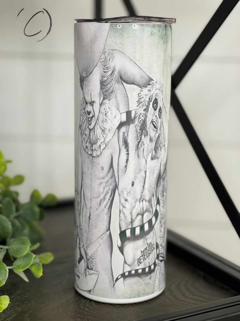 Hunks Of Horror 20oz Skinny Tumbler featuring a unique horror-themed design, complete with a reusable straw.