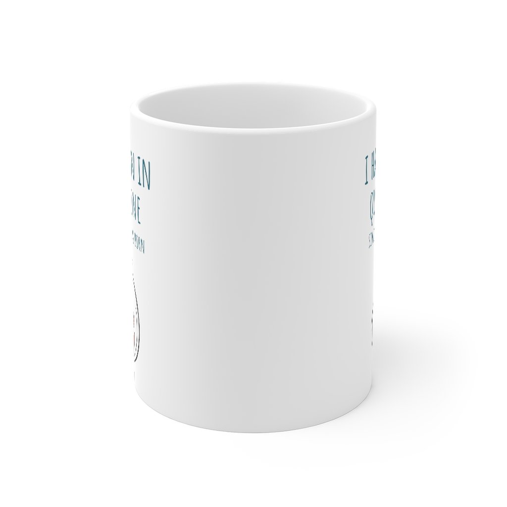 A white ceramic mug with the phrase 'I Have Been in Quarantine Since The Day I Was Born' printed on it, featuring a classic shape and C-handle.