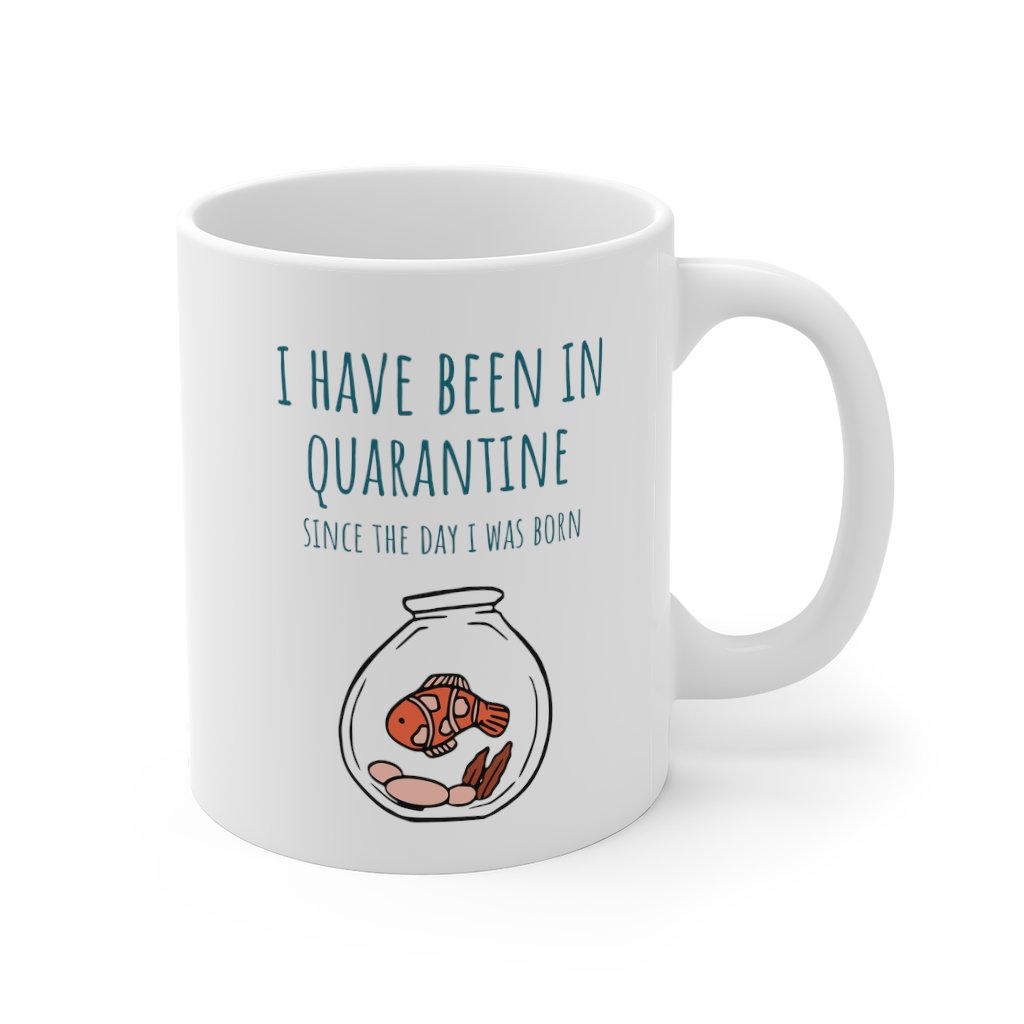 A white ceramic mug with the phrase 'I Have Been in Quarantine Since The Day I Was Born' printed on it, featuring a classic shape and C-handle.