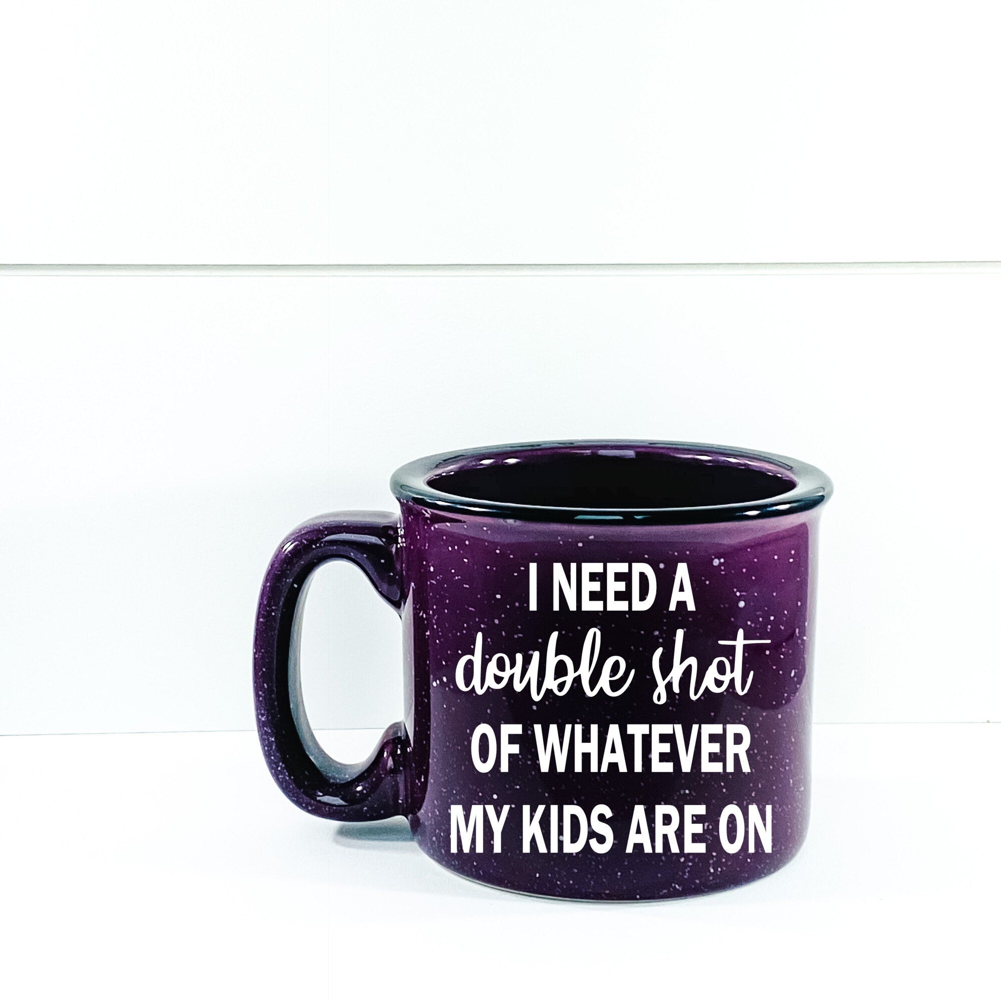 Ceramic campfire mug with humorous design for parents, featuring the phrase 'I Need A Double Shot Of Whatever My Kids Are On'.