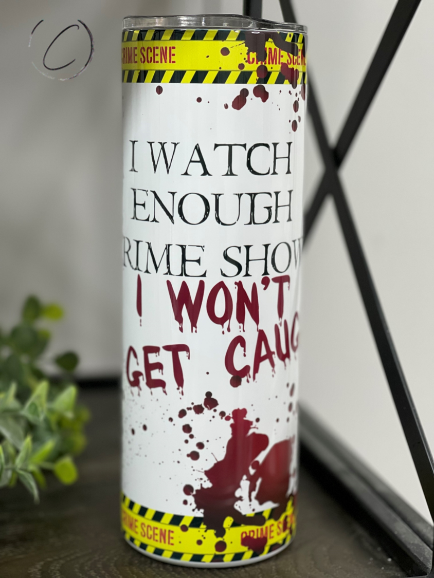 I Watch Crime Shows 20oz Skinny Tumbler featuring a full wrap design, perfect for crime show enthusiasts, with a reusable straw included.