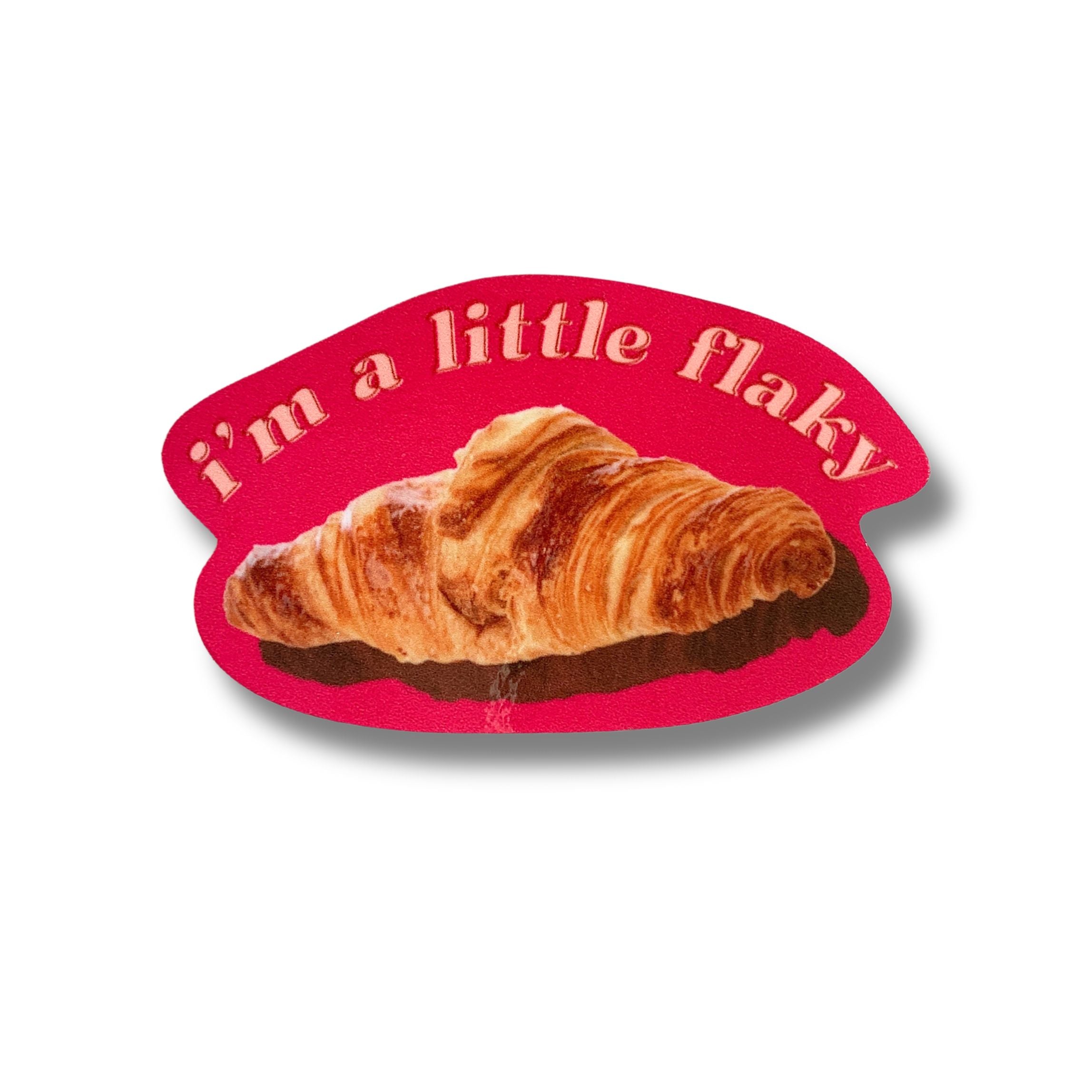 A vinyl die cut decal featuring a croissant with the text 'I’m a Little Flaky', perfect for personalizing items.