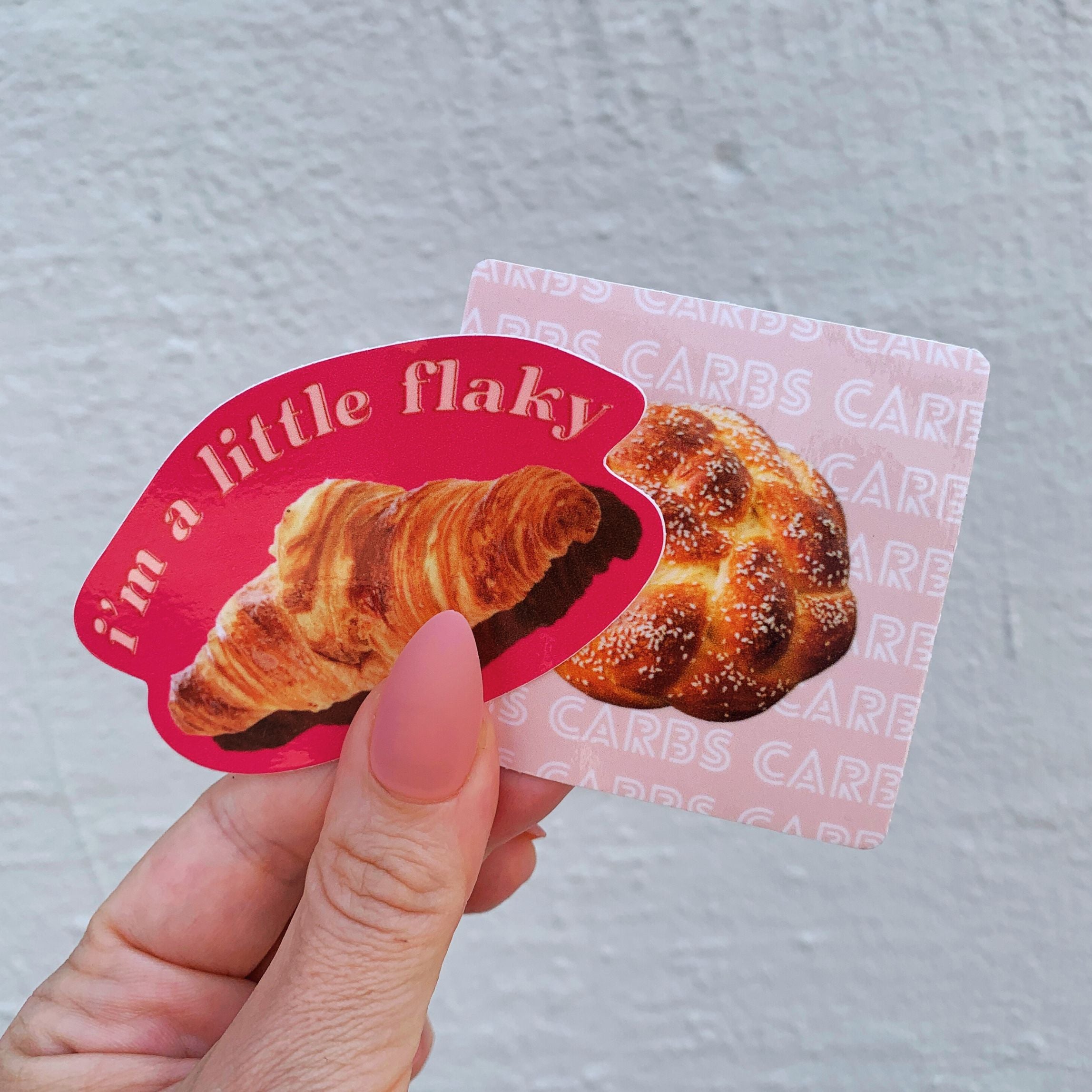 A vinyl die cut decal featuring a croissant with the text 'I’m a Little Flaky', perfect for personalizing items.