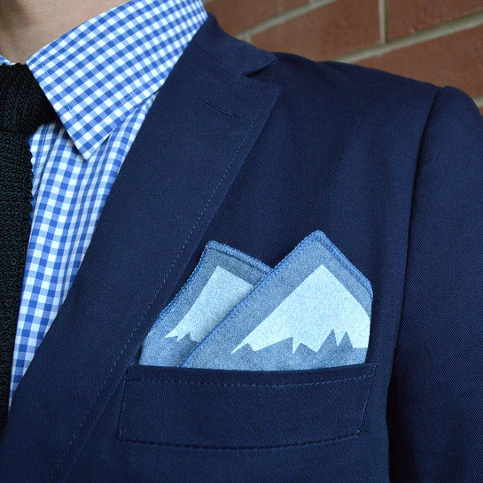 Stylish chambray pocket square with the quote 'I'm always outside on the inside', perfect for men's formal wear.