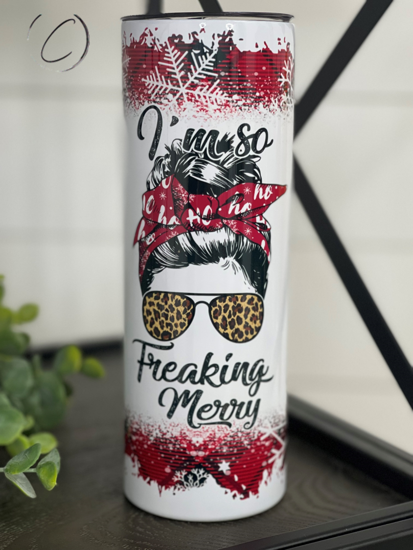 I'm So Freaking Merry 20oz Skinny Tumbler with festive design and reusable straw, perfect for holiday beverages.