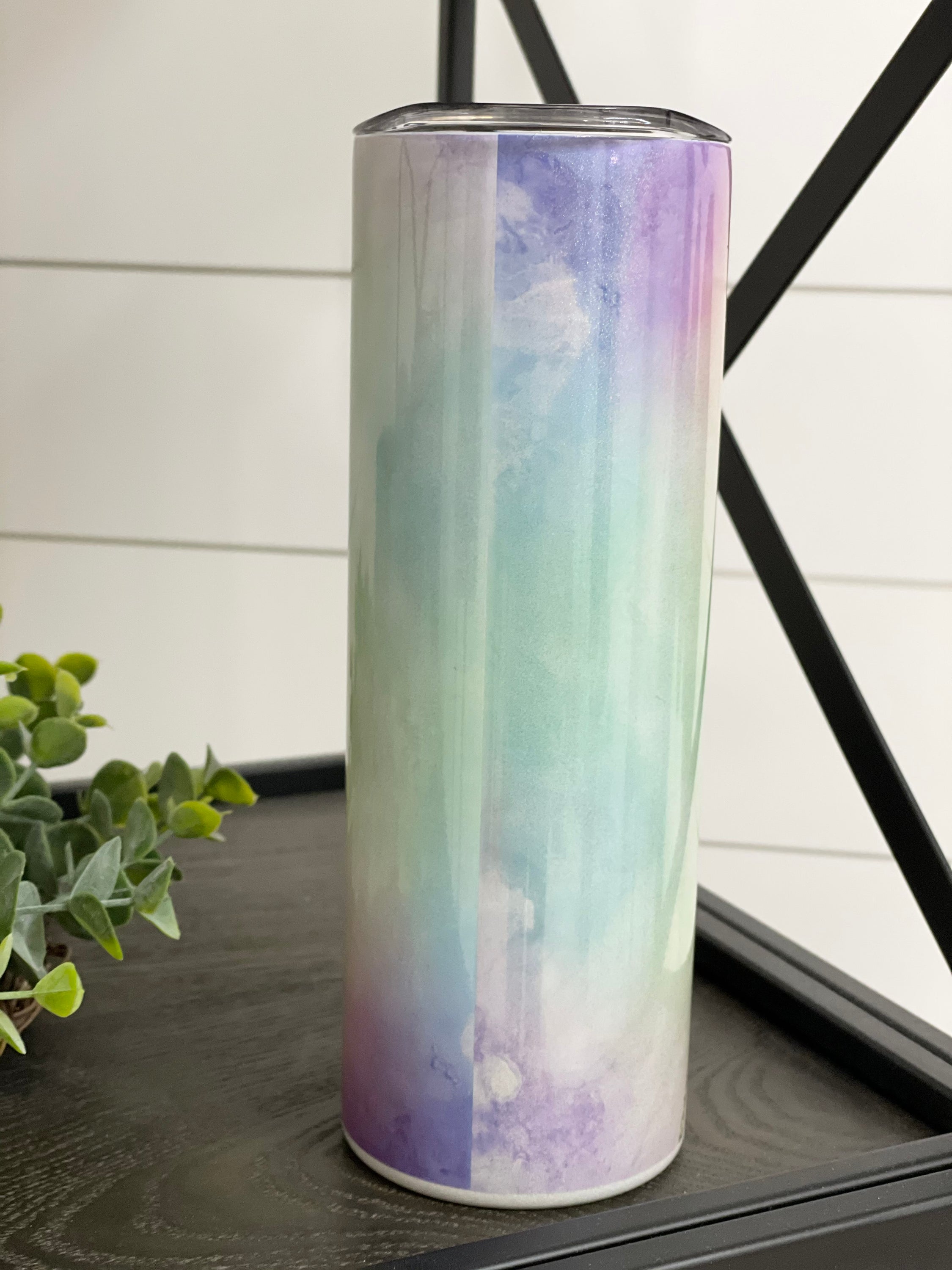 In A World... Be Kind 20oz Shimmer Skinny Tumbler with a rainbow shimmer effect and reusable straw.