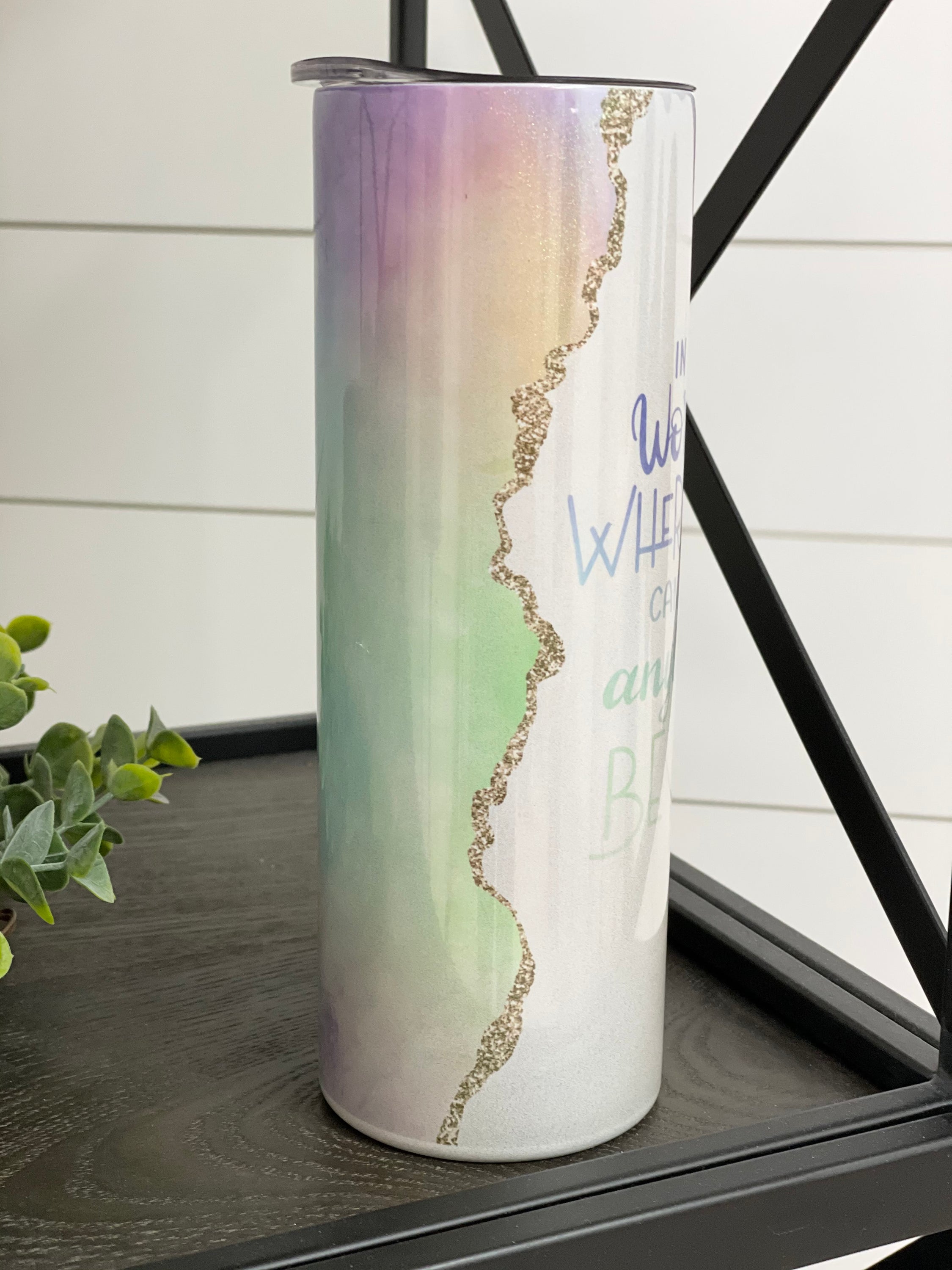 In A World... Be Kind 20oz Shimmer Skinny Tumbler with a rainbow shimmer effect and reusable straw.
