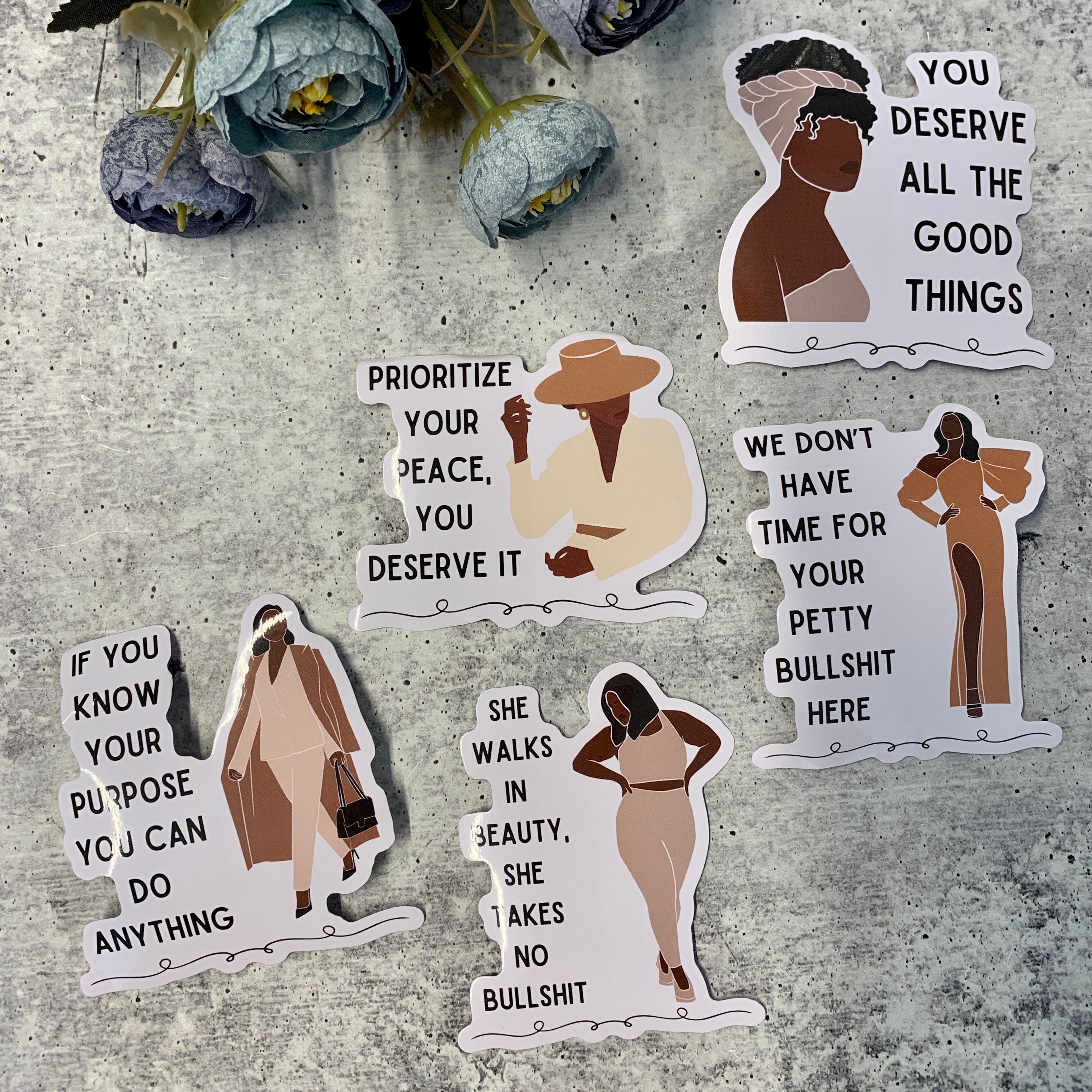 A vibrant sticker bundle featuring empowering quotes for women, ideal for personalizing laptops, phones, and water bottles.