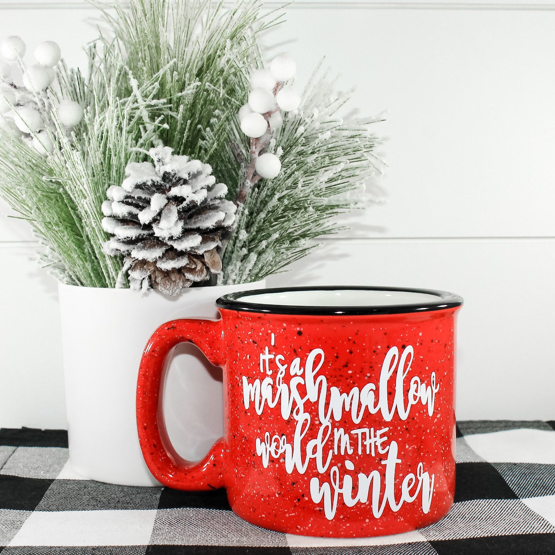 Ceramic campfire mug featuring a whimsical winter design, perfect for hot beverages.