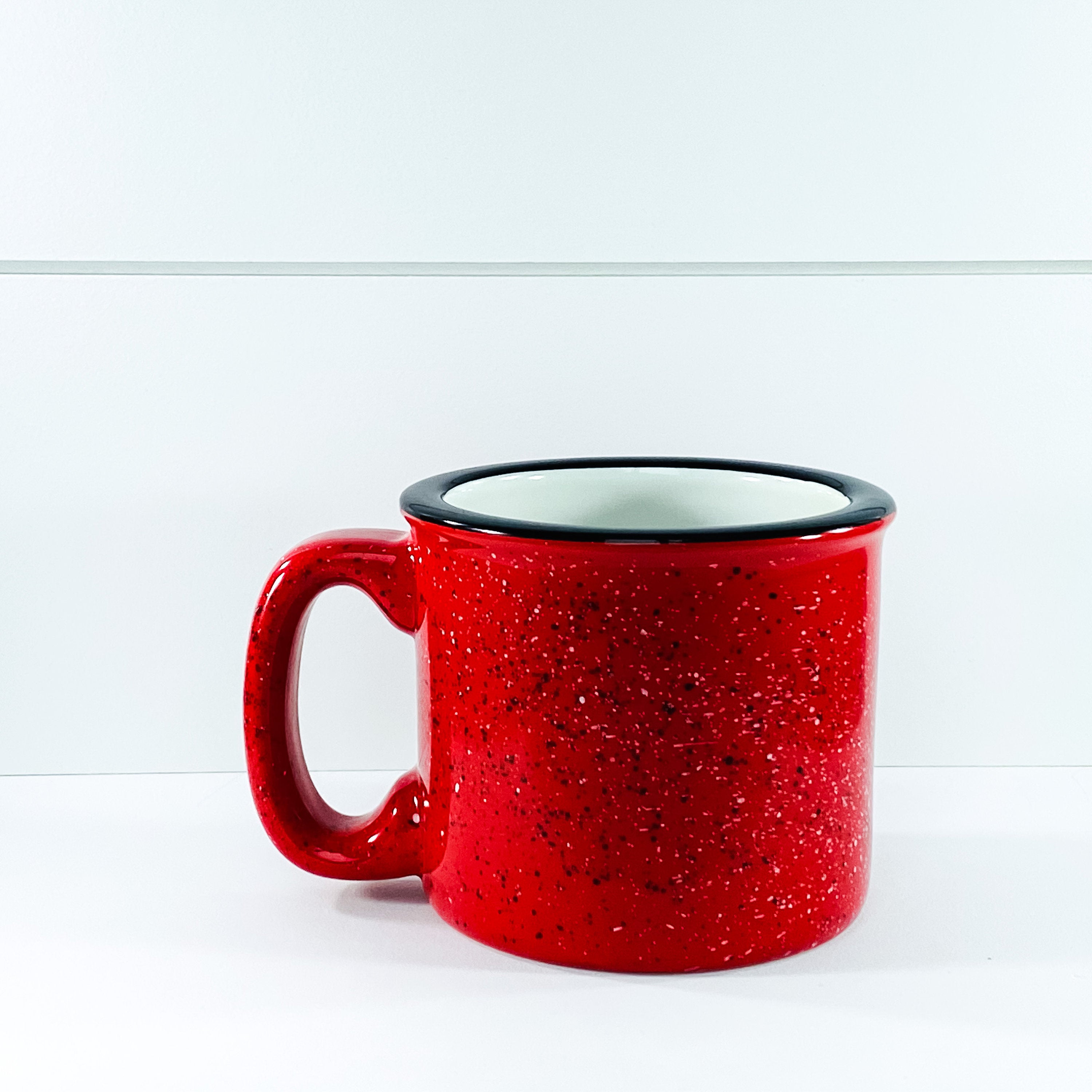 Ceramic campfire mug featuring a whimsical winter design, perfect for hot beverages.