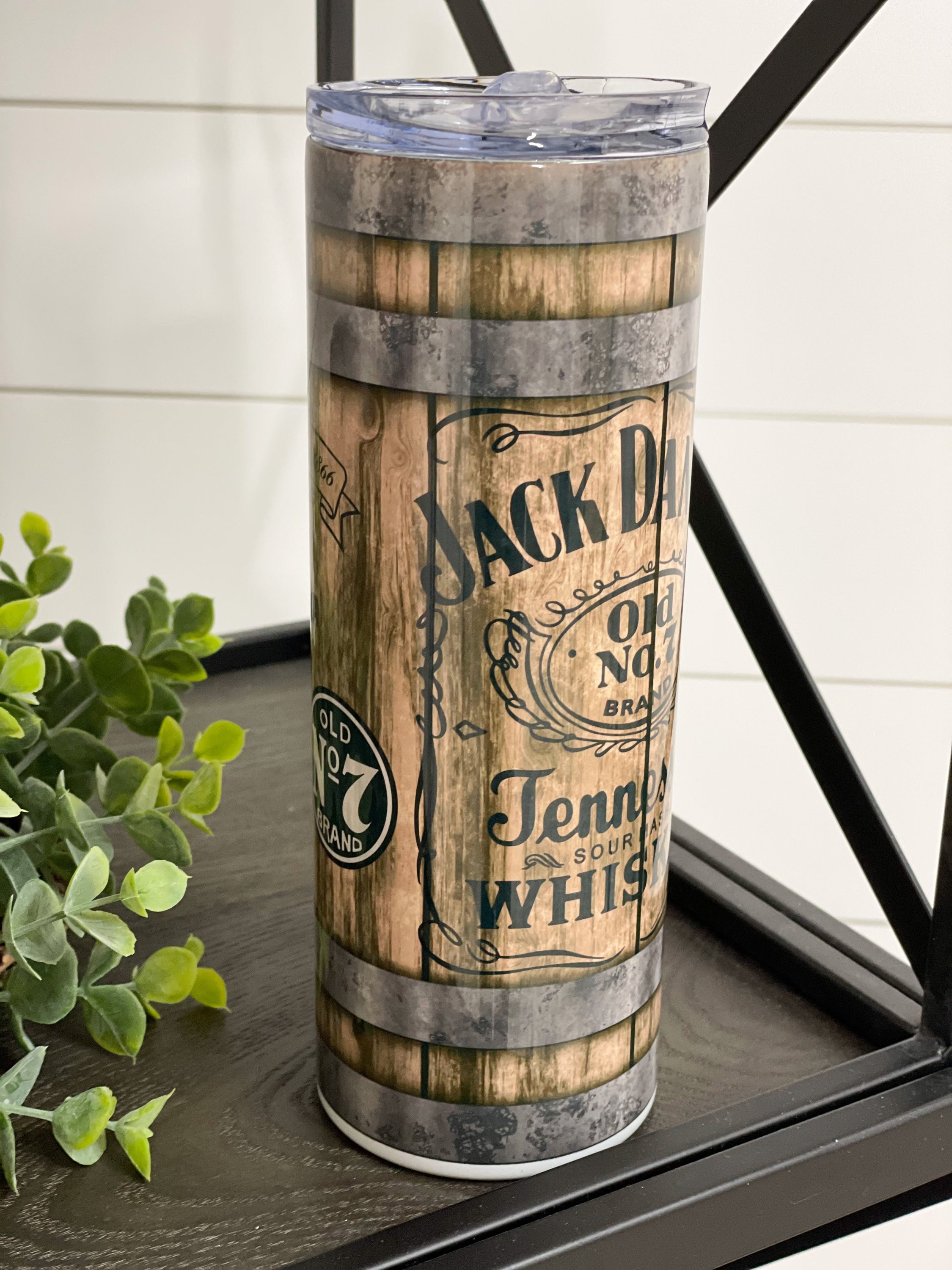 Jack Daniels 20oz Skinny Tumbler with full wrap design and reusable straw, perfect for hot and cold beverages.