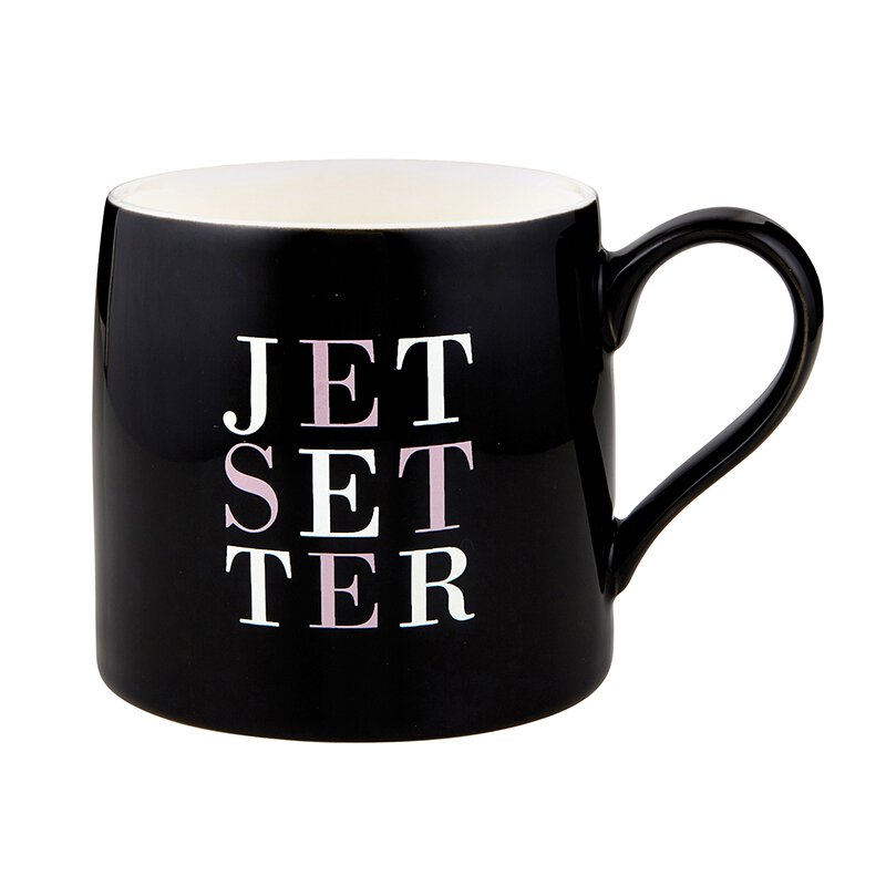 Jetsetter Jumbo Coffee Mug in black ceramic with white and pink lettering, measuring 6 inches in diameter and 4 inches high.