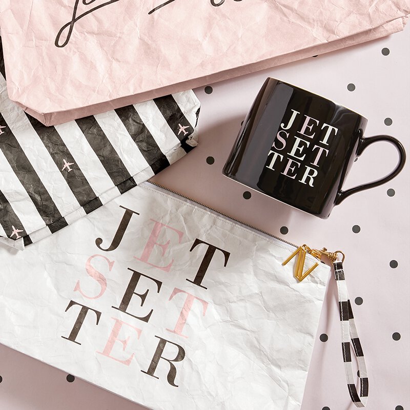 Jetsetter Jumbo Coffee Mug in black ceramic with white and pink lettering, measuring 6 inches in diameter and 4 inches high.