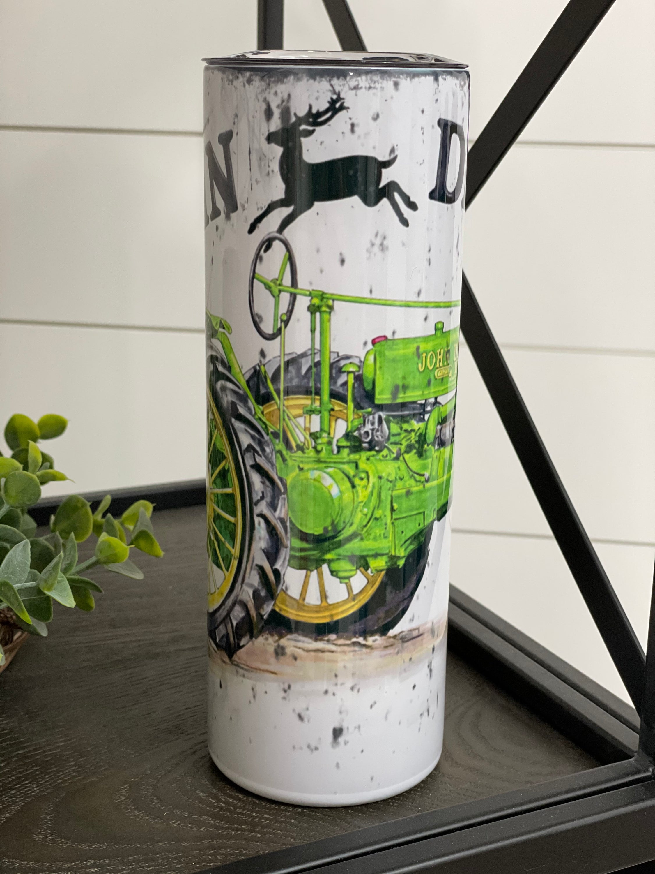John Deere 20oz Skinny Tumbler with full wrap design and reusable straw, perfect for hot and cold beverages.