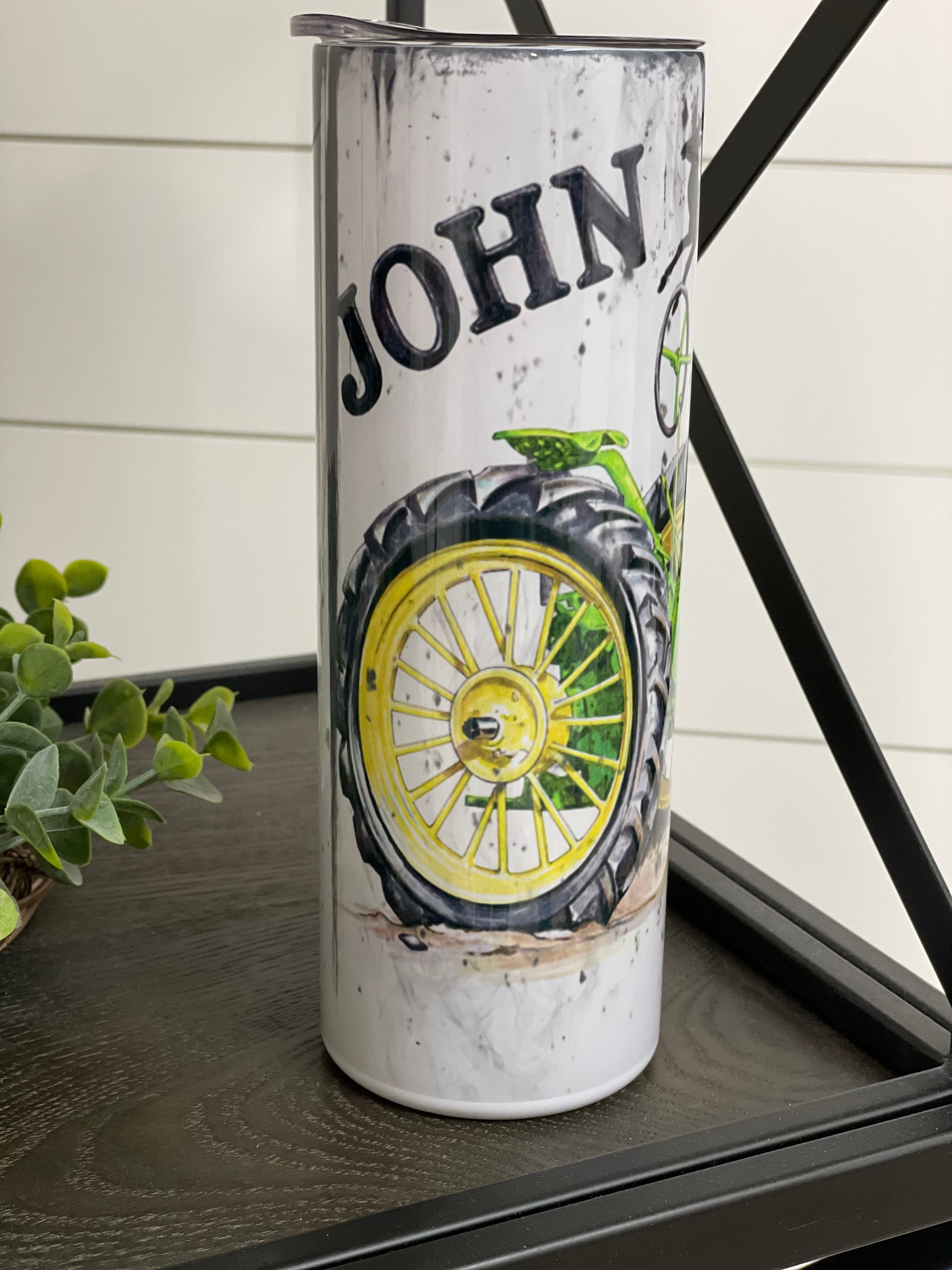 John Deere 20oz Skinny Tumbler with full wrap design and reusable straw, perfect for hot and cold beverages.