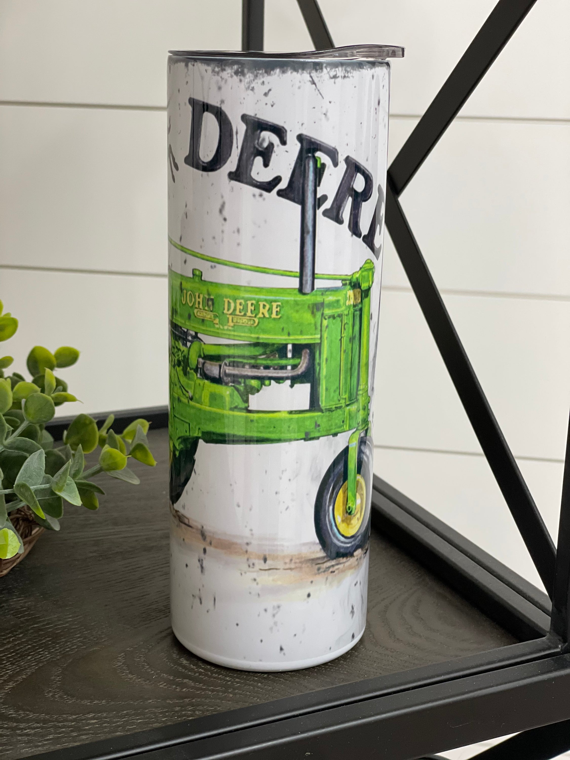 John Deere 20oz Skinny Tumbler with full wrap design and reusable straw, perfect for hot and cold beverages.