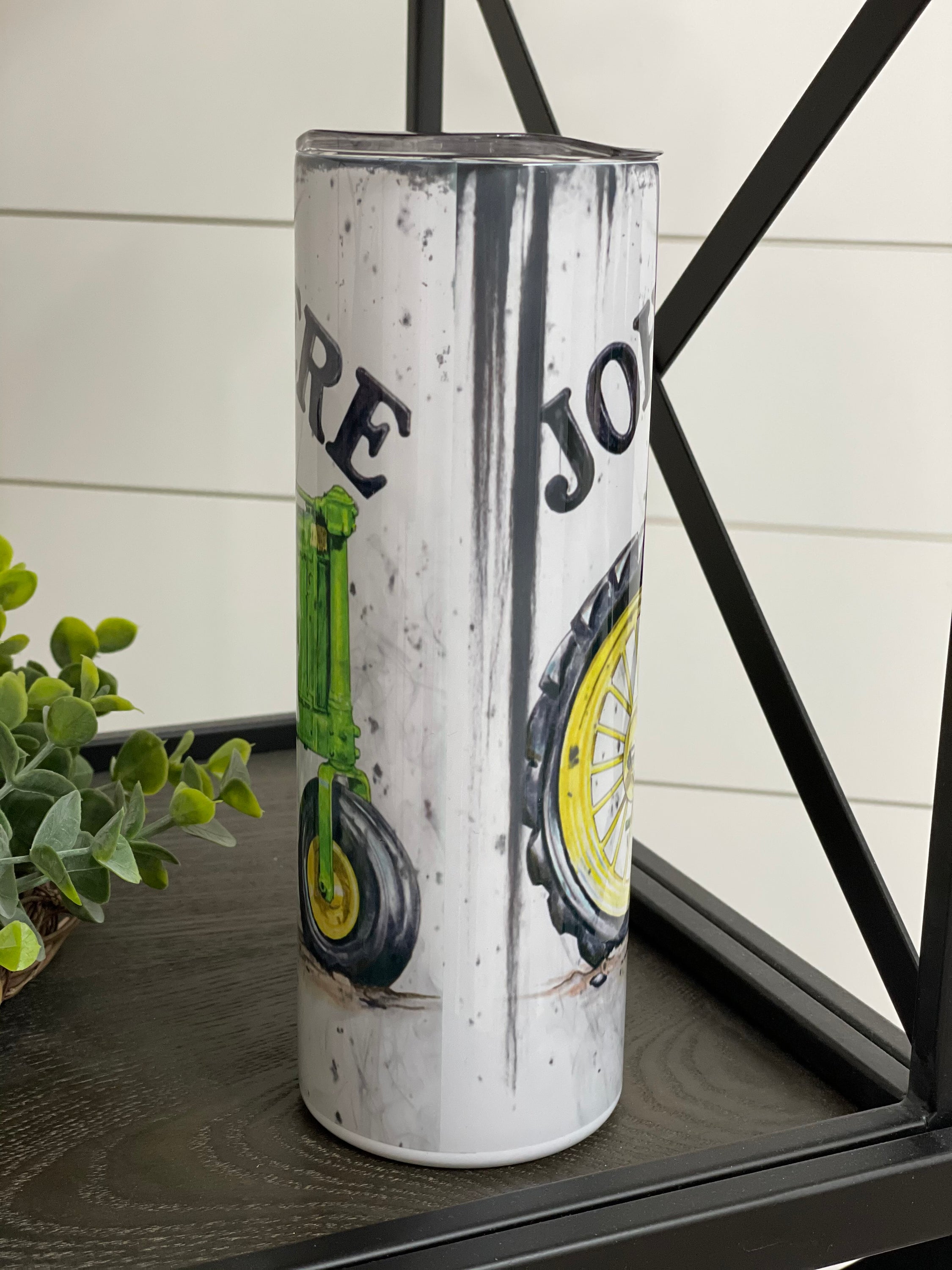 John Deere 20oz Skinny Tumbler with full wrap design and reusable straw, perfect for hot and cold beverages.