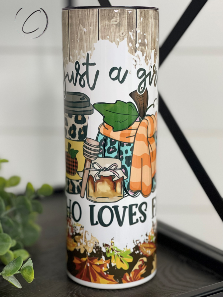 Just A Girl Who Loves Fall 20oz Skinny Tumbler with a vibrant autumn design and reusable straw.