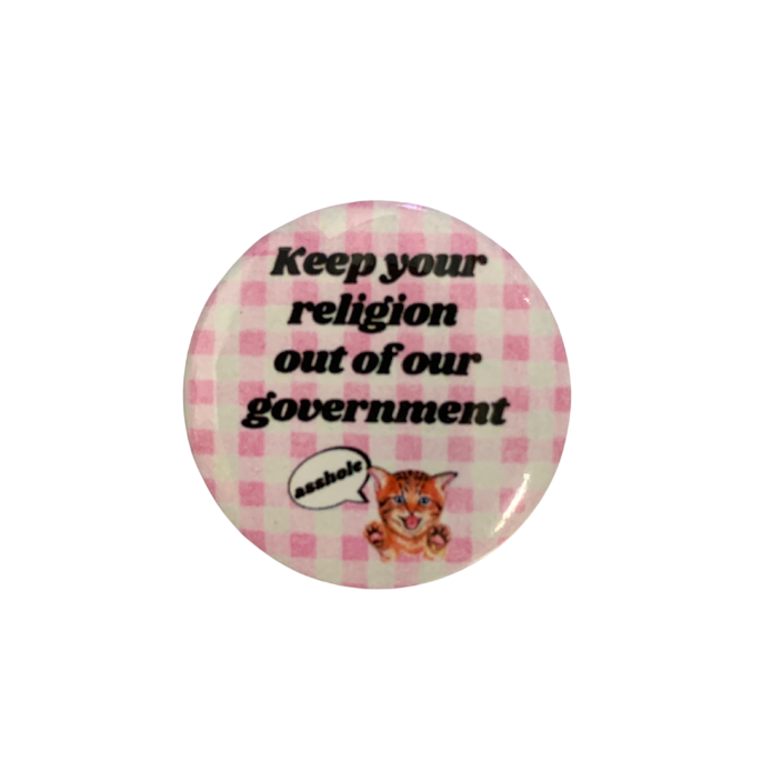 1.25 inch pinback button featuring an angry kitten with the text 'Keep Your Religion Out of Our Government, Asshole'.