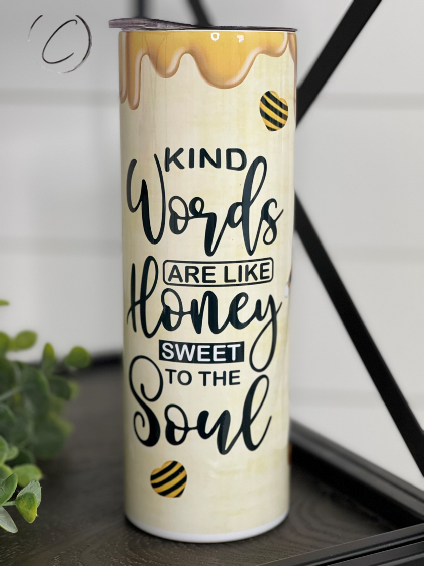 20oz skinny tumbler with 'Kind Words Are Like Honey' design, featuring a reusable straw and insulated body.