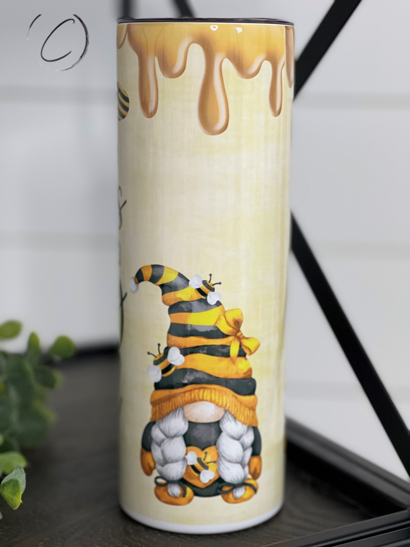 20oz skinny tumbler with 'Kind Words Are Like Honey' design, featuring a reusable straw and insulated body.