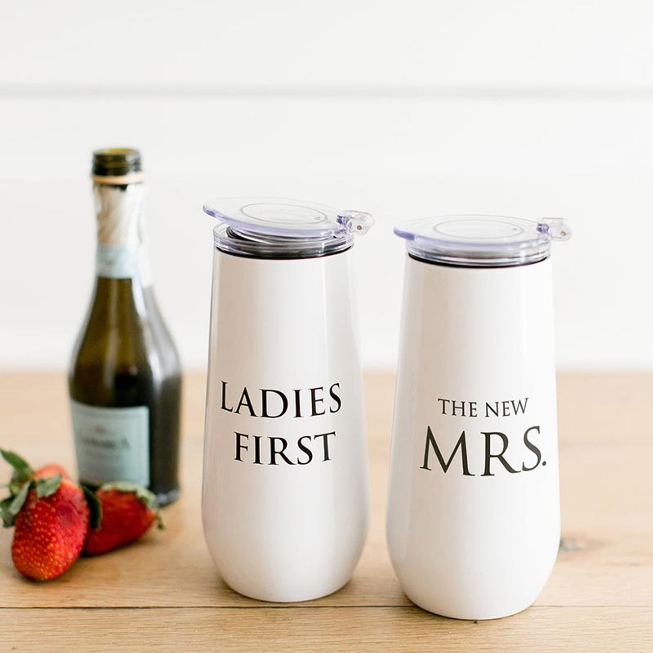 Ladies First Champagne Tumbler in stainless steel with a fliptop lid, perfect for enjoying bubbly drinks.