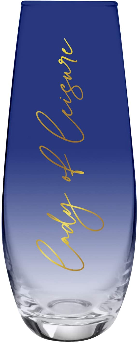 Set of four dark blue tinted stemless flute champagne glasses with gold lettering 'Lady of Leisure'.