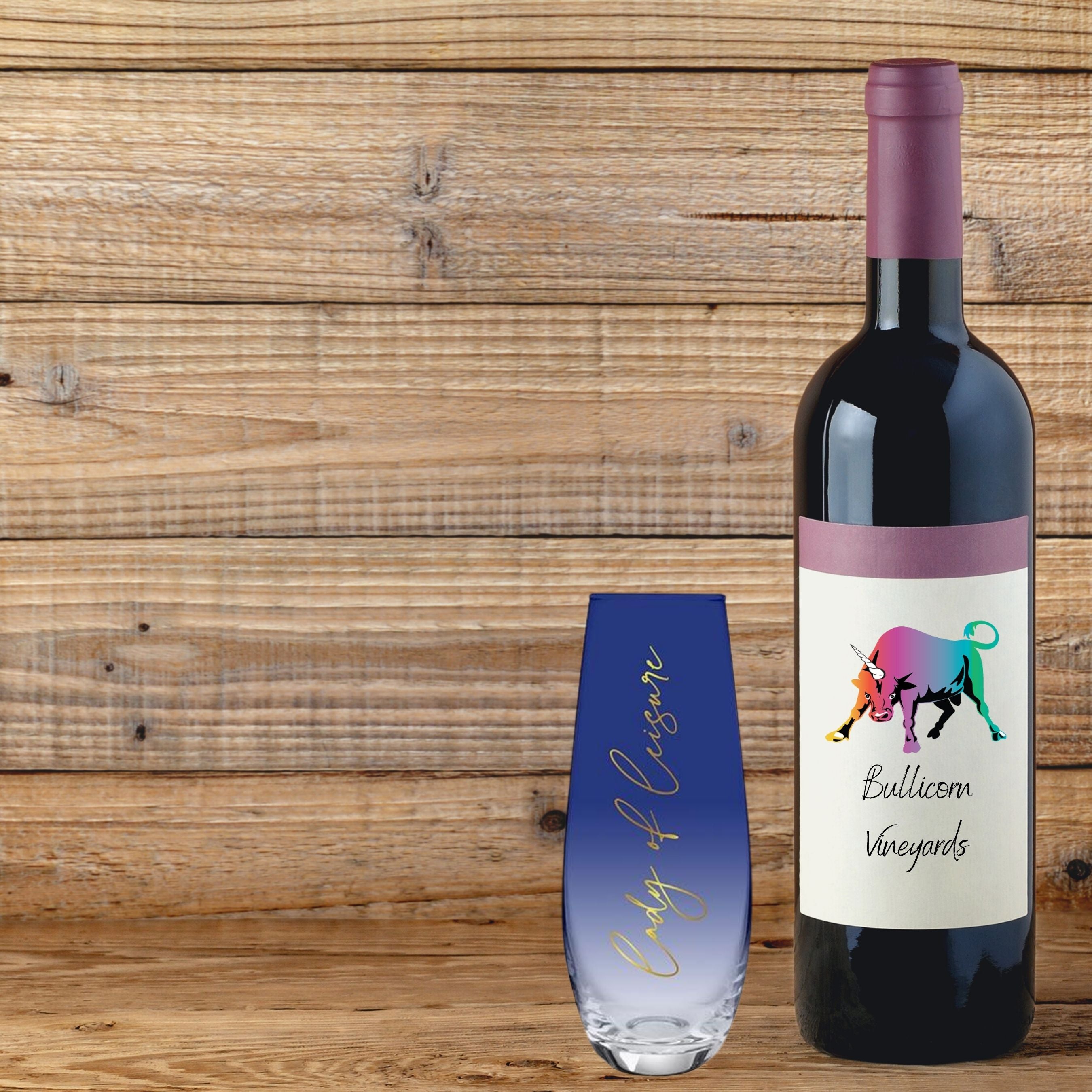 Lady of Leisure Stemless Flute Champagne Glass in dark blue tint with gold lettering, elegantly designed for champagne enjoyment.