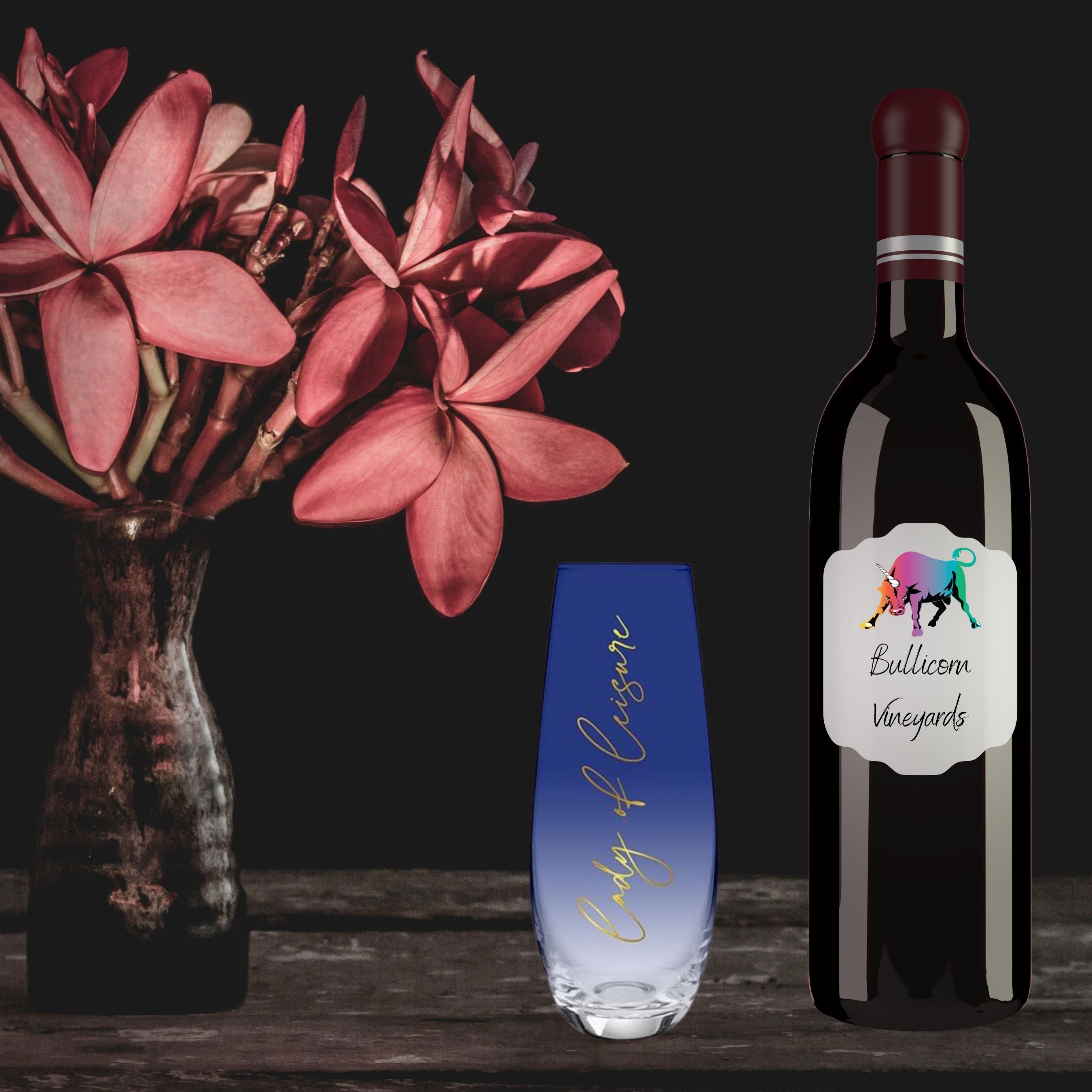 Lady of Leisure Stemless Flute Champagne Glass in dark blue tint with gold lettering, elegantly designed for champagne enjoyment.